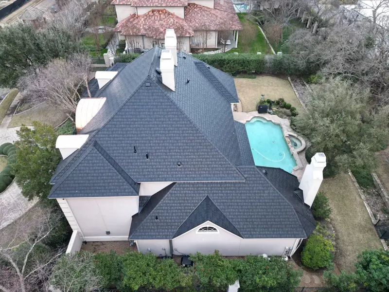 Aerial view of a new roof installed by Dimensional Pro Construction