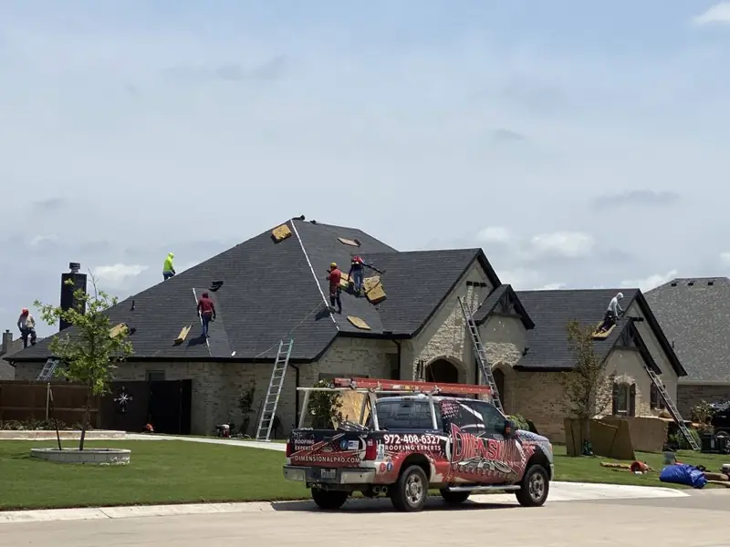 Dimensional Pro Construction crew working on a roof replacement